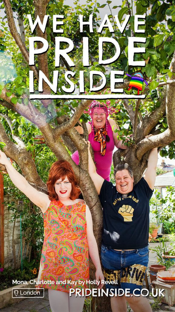 Poster for the Pride Inside project, photograph by Holly Revell. Mona Compleine, Charlotte Cooper and Kay Hyatt in lockdown. Theya re in a garden, Charlotte is in a tree. All are dressed in bright colours and sequins.